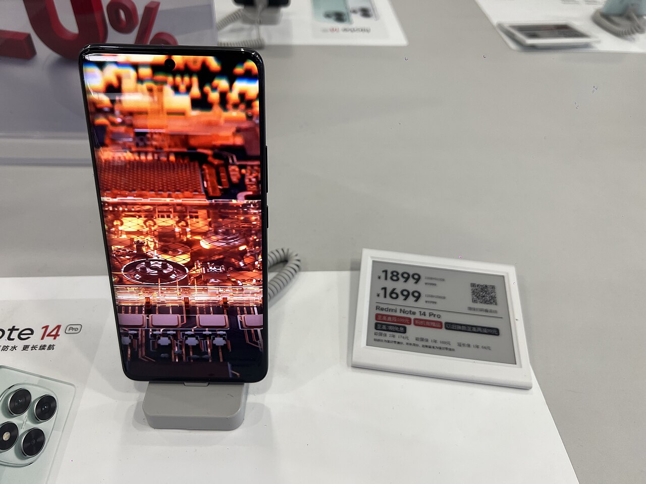 A Redmi Note 14 Pro display phone on a shop counter in China in December 2024
